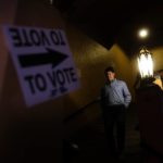 
              A person leaves after voting on Election Day, Tuesday, Nov. 8, 2022, in Atlanta. (AP Photo/Brynn Anderson)
            