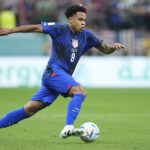 
              Weston McKennie of the United States controls the ball during the World Cup group B soccer match between England and The United States, at the Al Bayt Stadium in Al Khor , Qatar, Friday, Nov. 25, 2022. (AP Photo/Ashley Landis)
            