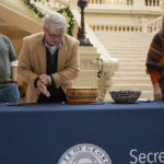 
              Gabriel Sterling, chief operating officer for the Georgia Secretary of State, rolls a 10-sided die as part of process to randomly determine which batches of ballots to audit for a state-wide risk limiting audit of the 2022 general election during a press conference Wednesday, Nov. 16, 2022, at the Georgia Capitol in Atlanta. (AP Photo/Ben Gray)
            