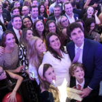 
              Arkansas Gov.-elect Sarah Huckabee Sanders, center, poses for a photo with family and supporters during her election night party Tuesday, Nov. 8, 2022, in Little Rock, Ark. (AP Photo/Will Newton)
            