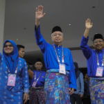 
              Malaysian Prime Minister Ismail Sabri Yaakob, center, waves to his supporters after his nomination documents were accepted for the upcoming general election in Bera, Pahang, Malaysia, Saturday, Nov. 5, 2022. (AP Photo/Ahmad Yusni)
            