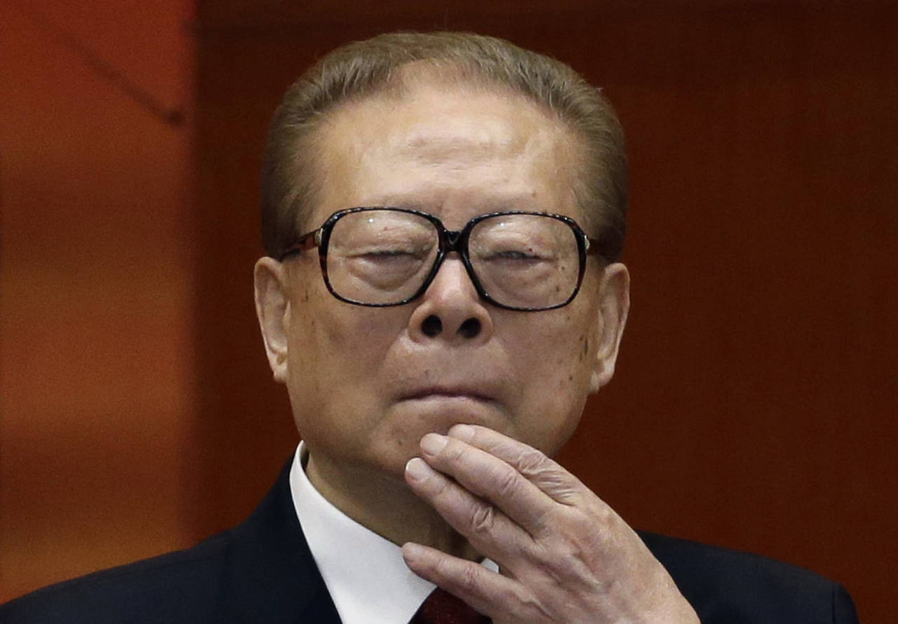 FILE - Former Chinese President Jiang Zemin watches the proceedings at the opening session of the 1...