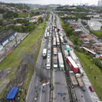 
              Truckers supportive of President Jair Bolsonaro block a highway to protest his run-off election loss to former President Luiz Inacio Lula da Silva in Embu das Artes, outskirts of Sao Paulo, Brazil, Tuesday, Nov. 1, 2022. (AP Photo/Andre Penner)
            