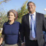 
              Israeli far-right lawmaker Itamar Ben Gvir and his wife leave after casting their ballots in the West Bank settlement of Kiryat Arba during Isreali elections, Tuesday, Nov. 1, 2022. (AP Photo/Tsafrir Abayov)
            