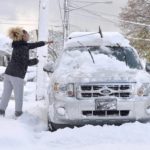 
              Taylor Olson clears snow from her car in the 400 block of East 33rd Street in Erie on Nov. 17, 2022. "I had to wake up a little early so I could brush my car off," said Olson, 23. "I wasn't ready for it." The region saw its first lake-effect storm of the season overnight Wednesday into Thursday, with about five inches of snow in the city. Areas of Erie County saw higher totals. (Christopher Millette/Erie Times-News via AP)
            