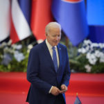 
              U.S. President Joe Biden walk to his desk during the ASEAN - U.S. summit in Phnom Penh, Cambodia, Saturday, Nov. 12, 2022. (AP Photo/Vincent Thian)
            