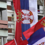 
              Kosovo Serbs wave Serbian flags during a protest in Mitrovica, Kosovo, Sunday, Nov. 6, 2022. Several thousand ethnic Serbs on Sunday rallied in Kosovo after a dispute over vehicle license plates triggered a Serb walkout from their jobs in Kosovo's institutions and heightened ongoing tensions stemming from a 1990s' conflict. (AP Photo/Bojan Slavkovic)
            