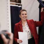 
              Danish Prime Minister Mette Frederiksen smiles before casting at a polling station in Hareskovhallen in Vaerloese, Denmark, on Tuesday, Nov 1, 2022. Denmark's election on Tuesday is expected to change its political landscape, with new parties hoping to enter parliament and others seeing their support dwindle. A former prime minister who left his party to create a new one this year could end up as a kingmaker, with his votes being needed to form a new government. (AP Photo/Sergei Grits)
            