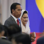 
              Indonesian President Joko Widodo and his wife Iriana arrive for the opening ceremony of the 40th and 41st ASEAN Summits (Association of Southeast Asian Nations) in Phnom Penh, Cambodia, Friday, Nov. 11, 2022. The ASEAN summit kicks off a series of three top-level meetings in Asia, with the Group of 20 summit in Bali to follow and then the Asia Pacific Economic Cooperation forum in Bangkok. (AP Photo/Vincent Thian)
            