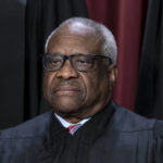 
              FILE - Associate Justice Clarence Thomas joins other members of the Supreme Court as they pose for a new group portrait, at the Supreme Court building in Washington, Oct. 7, 2022. Lawyers who aided former President Donald Trump's efforts to overturn the results of the 2020 election regarded an appeal to Thomas as a "key" to their success. (AP Photo/J. Scott Applewhite, File)
            
