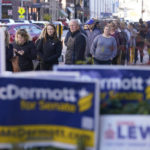 
              Voters stand in line waiting to cast their early ballots at the City-County Building, Monday, Nov. 7, 2022, in Indianapolis. (AP Photo/Darron Cummings)
            
