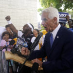 
              Democratic candidate for Florida governor Charlie Crist, right, campaigns at an early voting location, Sunday, Nov. 6, 2022, in Miami. At left is former NBA basketball player Ray Allen. (AP Photo/Lynne Sladky)
            