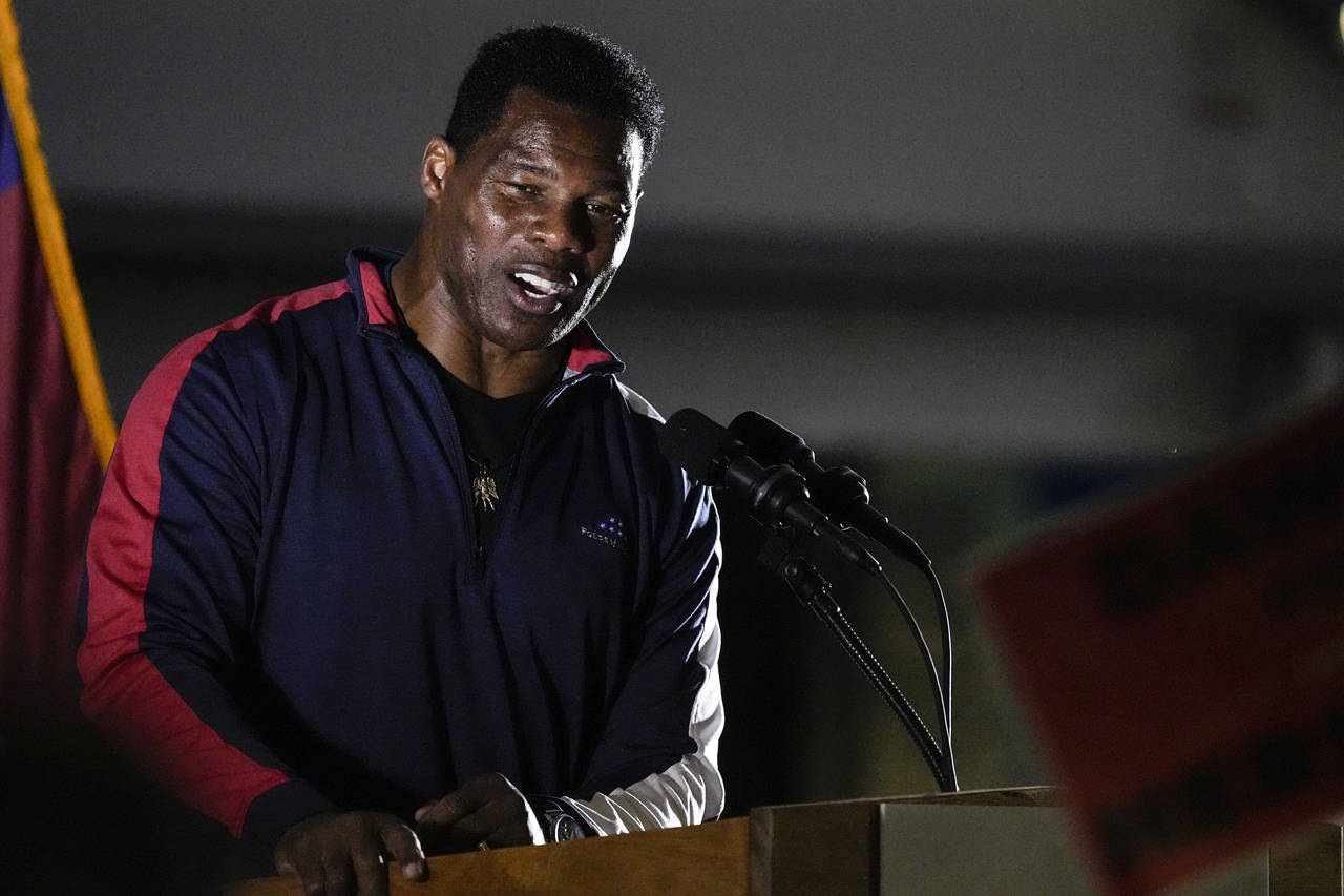 FILE - Republican nominee for U.S. Senate Herschel Walker speaks during a campaign rally on Thursda...