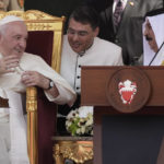 
              Pope Francis talks with Bahrain's King Hamad bin Isa Al Khalifa as they attend the closing session of the "Bahrain Forum for Dialogue: East and west for Human Coexistence", at the Al-Fida square at the Sakhir Royal palace, Bahrain, Friday, Nov. 4, 2022. Pope Francis is making the November 3-6 visit to participate in a government-sponsored conference on East-West dialogue and to minister to Bahrain's tiny Catholic community, part of his effort to pursue dialogue with the Muslim world. (AP Photo/Alessandra Tarantino)
            