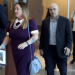 
              Lori Alhadeff, holding a photo of her daughter Alyssa, and her husband Ilan Alhadeff walk into court during the sentencing hearing for Marjory Stoneman Douglas High School shooter Nikolas Cruz at the Broward County Courthouse in Fort Lauderdale, Fla., on Wednesday, Nov. 2, 2022.  Cruz was sentenced to life in prison for murdering 17 people at Parkland's Marjory Stoneman Douglas High School more than four years ago. (Mike Stocker/South Florida Sun Sentinel via AP, Pool)
            