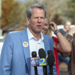 
              Republican candidate for Georgia Governor Gov. Brian Kemp gives a statement to members of the media Tuesday, Nov. 8, 2022 in Winterville, Ga. (AP Photo/Brett Davis)
            