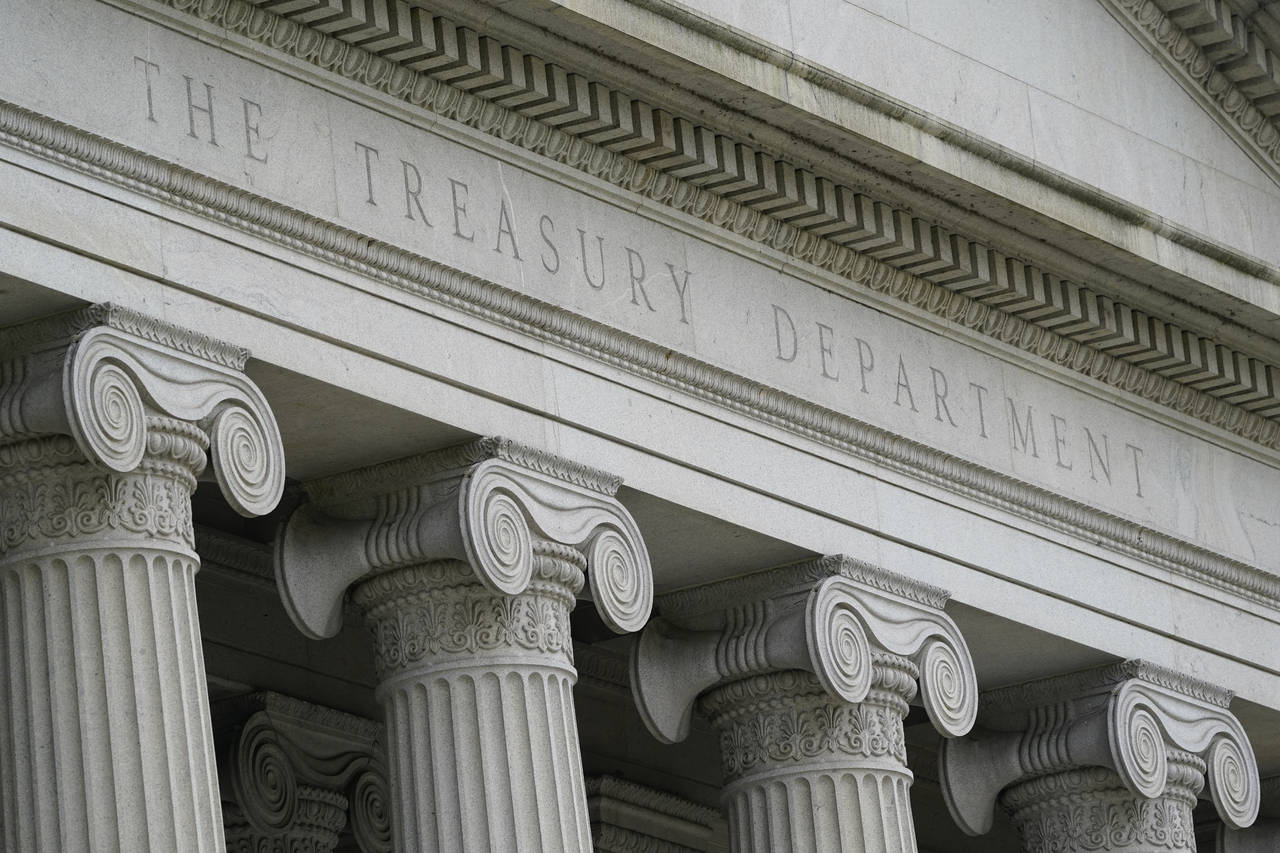 FILE - The Treasury Building is viewed in Washington, May 4, 2021.  The U.S. on Thursday imposed sa...