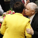 
              FILE -Jaroslaw Kaczynski, the leader of Poland's ruling Law and Justice party gives Prime Minister Beata Szydlo a kiss and a bunch of flowers after her government survived a vote in which the opposition was seeking to oust it, at the parliament building in Warsaw, Poland, Thursday, Dec. 7, 2017. Poland’s ruling party leader has triggered anger and mockery by claiming that the country’s low birthrate is partly caused by overconsumption of alcohol by young women. Opposition politicians and many other critics accused Jaroslaw Kaczynski, a 73-year-old lifelong bachelor, of being out of touch. (AP Photo/Czarek Sokolowski, File)
            