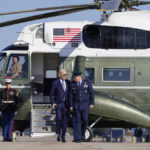 
              President Joe Biden is escorted by Col. William "Chris" McDonald, Vice Commander, 89th Airlift Wing, as he walks to board Air Force One, Thursday, Nov. 3, 2022, at Andrews Air Force Base, Md. Biden is en route to Albuquerque, N.M., to begin a four-state, three-day campaign swing. (AP Photo/Patrick Semansky)
            