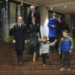 
              Boston Mayor Michelle Wu, back, second right, and her family and Gov.-elect Maura Healey, back, third right, walk with Britain's Prince William and Kate, Princess of Wales, in Boston City Hall on Wednesday, Nov. 30, 2022, in Boston. The Prince and Princess of Wales are making their first overseas trip since the death of Queen Elizabeth II in September. (Nancy Lane/The Boston Herald via AP, Pool)
            