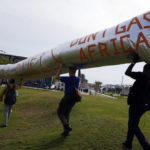 
              Protesters display don't gas Africa, made to look like a pipeline, at the COP27 U.N. Climate Summit, Thursday, Nov. 17, 2022, in Sharm el-Sheikh, Egypt. (AP Photo/Peter Dejong)
            