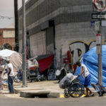 
              FILE - Tents line the streets of Skid Row area of Los Angeles on July 22, 2022. California Gov. Gavin Newsom has agreed to release $1 billion in state homelessness funding he testily put on pause earlier this month. But his office says he will do so only if local governments agree to step up the aggressiveness of their plans going forward to reduce homelessness. (AP Photo/Damian Dovarganes, File)
            