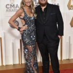 
              Luke Combs, right, and Nicole Hocking arrive at the 56th Annual CMA Awards on Wednesday, Nov. 9, 2022, at the Bridgestone Arena in Nashville, Tenn. (Photo by Evan Agostini/Invision/AP)
            