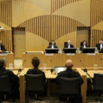 
              Presiding judge Hendrik Steenhuis, fourth from right, speaks during the verdict session of the Malaysia Airlines Flight 17 trial at the high security court at Schiphol airport, near Amsterdam, Netherlands, Thursday, Nov. 17, 2022. The Hague District Court, sitting at a high-security courtroom at Schiphol Airport, is passing judgment on three Russians and a Ukrainian charged in the downing of Malaysia Airlines flight MH17 over Ukraine and the deaths of all 298 passengers and crew on board, against a backdrop of global geopolitical upheaval caused by Russia's full-blown invasion of Ukraine in February and the nearly nine-month war it triggered. (AP Photo/)
            