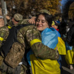 
              A Kherson resident hugs a Ukrainian defence force member in Kherson, southern Ukraine, Monday, Nov. 14, 2022. The retaking of Kherson was one of Ukraine's biggest successes in the nearly nine months since Moscow's invasion. (AP Photo/Bernat Armangue)
            