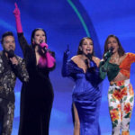 
              Hosts Luis Fonsi, from left, Laura Pausini, Thalia and Anitta appear onstage at the conclusion of the 23rd annual Latin Grammy Awards at the Mandalay Bay Michelob Ultra Arena on Thursday, Nov. 17, 2022, in Las Vegas. (AP Photo/Chris Pizzello)
            