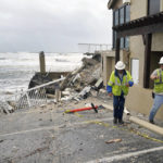 
              Workers check on a possible gas leak at the Pirates Cove Condos after part of the building collapsed due to a storm surge by Hurricane Nicole Thursday, Nov. 10, 2022, in Daytona Beach Shores, Fla. (AP Photo/John Raoux)
            