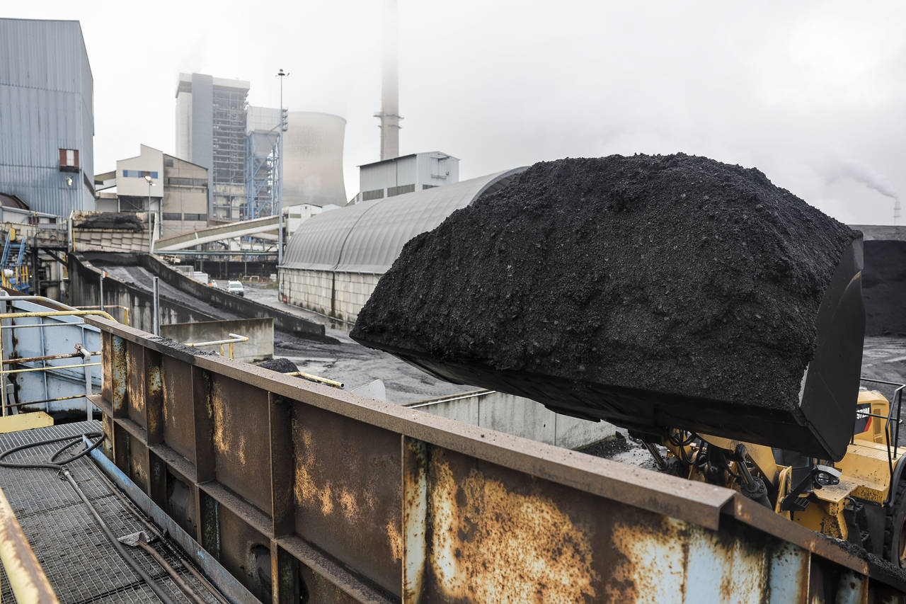 A tractor holding coal is pictured at the coal-fired power station Tuesday, Nov. 29, 2022 in Saint-...