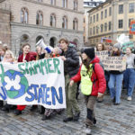 
              Climate activists of the youth-led organization Auroras march in Stockholm, Sweden, Friday, Nov. 25, 2022. Writing on banner reads in Swedish "Now we sue the State" (Christine Ohlsson/TT News Agency via AP)
            