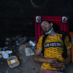 
              Ryan Smith, a 36-year-old homeless addict, falls asleep after smoking fentanyl in Los Angeles, Thursday, Aug. 18, 2022. Nearly 2,000 homeless people died in the city from April 2020 to March 2021, a 56% increase from the previous year, according to a report released by the Los Angeles County Department of Public Health. Overdose was the leading cause of death, killing more than 700. (AP Photo/Jae C. Hong)
            
