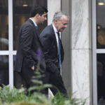 
              Former State Rep. Michael DiMassa, left, arrives at US District Court in Hartford with his attorney John Gulash, Tuesday, Nov. 1, 2022. DiMassa is accused of stealing federal COVID relief money by billing the city of West Haven, where he also worked as an aide to the City Council, for pandemic related consulting services that federal officials said he never performed. (Jessica Hill/Hartford Courant via AP)
            
