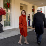 
              FILE - House Minority Leader Nancy Pelosi of Calif., left, speaks to a reporter as she and Senate Minority Leader Sen. Chuck Schumer of N.Y., right, walk back into the West Wing after speaking to members of the media outside of the White House in Washington, following a meeting with President Donald Trump, Dec. 11, 2018. (AP Photo/Andrew Harnik, File)
            