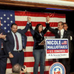 
              U.S. Rep. Nicole Malliotakis, R-N.Y., center, reacts at the Republican Election Night party, Tuesday, Nov. 8, 2022, in the Staten Island borough of  New York. The lone Republican representative in New York City, Nicole Malliotakis, won her rematch with Democrat Max Rose in a district consisting of Staten Island and a slice of Brooklyn. (Jason Paderon/Staten Island Advance via AP)
            