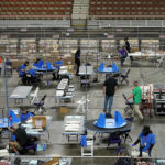 
              FILE - Maricopa County ballots cast in the 2020 general election are examined and recounted by contractors working for Florida-based company, Cyber Ninjas, in Phoenix on May 6, 2021. A judge has blocked a rural Arizona county's plan to hand-count all the ballots in the Nov. 8, 2022, election. The full hand-count was ordered by Republican officials in Cochise County who have made unfounded claims that vote-counting machines are untrustworthy. The ruling on Monday, Nov. 7, from Pima County Superior Court Judge Casey F. McGinley came after a full-day hearing late the week before, in which opponents spoke out against the proposal. (AP Photo/Matt York, Pool, File)
            