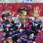 
              Incumbent Florida Republican Gov. Ron DeSantis holds his son Mason as he celebrates winning reelection, at an election night party in Tampa, Fla, Tuesday, Nov. 8, 2022. (AP Photo/Rebecca Blackwell)
            