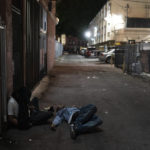 
              Two addicts sleep in an alley in Los Angeles, Wednesday, Sept. 21, 2022. Nearly 2,000 homeless people died in the city from April 2020 to March 2021, a 56% increase from the previous year, according to a report released by the Los Angeles County Department of Public Health. Overdose was the leading cause of death, killing more than 700. (AP Photo/Jae C. Hong)
            