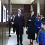 
              Boston Mayor Michelle Wu, right, and her family show photographs of Queen Elizabeth II's visit in 1976, during the visit of Britain's Prince William and Kate, Princess of Wales, to Boston City Hall on Wednesday, Nov. 30, 2022, in Boston. The Prince and Princess of Wales are making their first overseas trip since the death of Queen Elizabeth II in September. (Nancy Lane/The Boston Herald via AP, Pool)
            