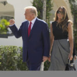 
              Former President Donald Trump walks out with Melania Trump, after voting at Morton and Barbara Mandel Recreation Center on Election Day, Tuesday, Nov. 8, 2022, in Palm Beach, Fla. (AP Photo/Andrew Harnik)
            