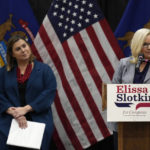 
              U.S. Rep. Elissa Slotkin, D-Mich., looks towards Rep. Liz Cheney, R-Wyo., as Cheney offers her support during a campaign rally, Tuesday, Nov. 1, 2022, in East Lansing, Mich. Slotkin emphasized how a shared concern for a functioning democracy can unite Democrats and Republicans despite policy disagreements. (AP Photo/Carlos Osorio)
            