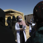 
              A volunteer doctor holds an awareness session about cholera to residents the Salaheddine refugee camp in northwestern Syria on Wednesday, Sept. 28, 2022. In recent weeks, thousands of cholera cases have swept across the crisis-stricken countries of Lebanon, Syria, and Iraq. (AP Photo/Ghaith Alsayed)
            