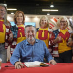 
              Supporters of former President Donald Trump line up behind Sen. Ted Cruz, R-Texas, to pose for photos during a book signing at the Conservative Political Action Conference (CPAC) in Dallas, on Aug. 5, 2022. (AP Photo/LM Otero)
            