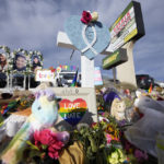 
              Crosses for the victims stand as part of a makeshift memorial near the scene of a mass shooting at a gay nightclub Wednesday, Nov. 23, 2022, in Colorado Springs, Colo. The alleged shooter facing possible hate crime charges in the fatal shooting of five people at a Colorado Springs gay nightclub is scheduled to make their first court appearance Wednesday from jail after being released from the hospital a day earlier.  (AP Photo/David Zalubowski)
            
