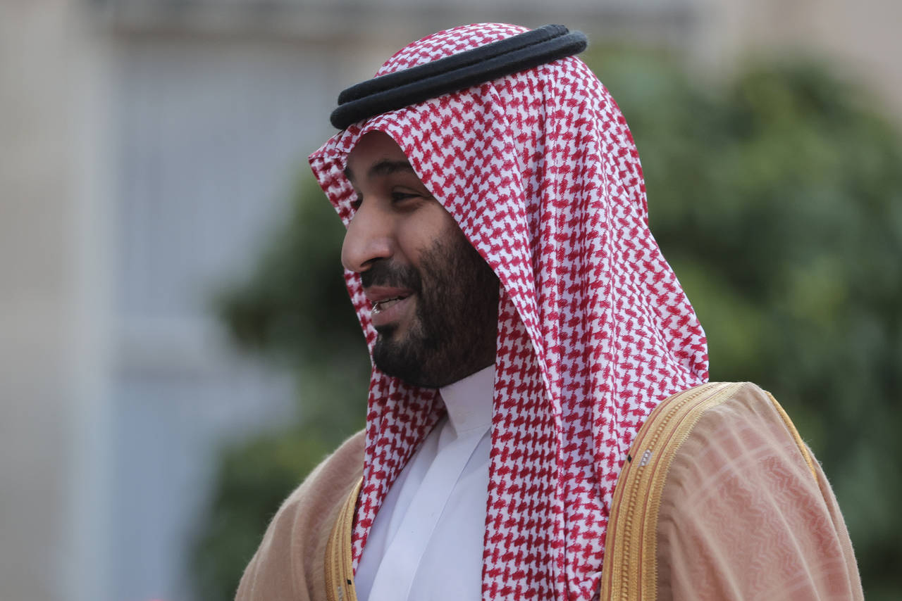 FILE - Saudi Crown Prince Mohammed bin Salman prepares to greet French President Emmanuel Macron as...