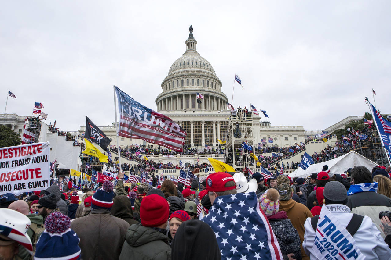 FILE - Rioters loyal to President Donald Trump rally at the U.S. Capitol in Washington on Jan. 6, 2...