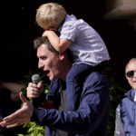 
              Republican U.S. Senate candidate Blake Masters holds his son, Rex, 2, as he speaks at a rally, Monday, Nov. 7, 2022, in Gilbert, Ariz. (AP Photo/Matt York)
            
