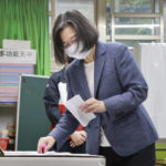 
              Taiwan President Tsai Ing-wen casts her ballots at a polling station in New Taipei City, Taiwan, Saturday, Nov. 26, 2022. Voters headed to the polls across Taiwan in a closely watched local election Saturday that will determine the strength of the island's major political parties ahead of the 2024 presidential election. (Chang Hao-an/Pool Photo via AP)
            